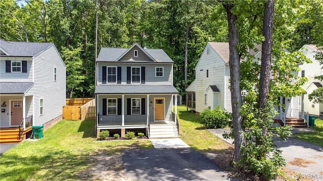 5415 Edgefield St, Henrico, VA 23227 - view of front facade with a porch, a front lawn, and a shingled roof