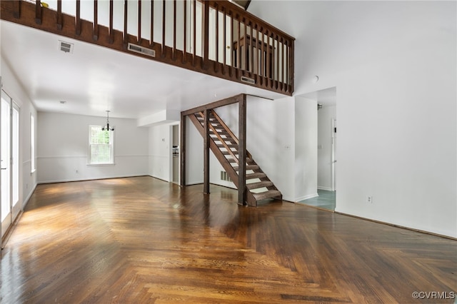 13503 Headwaters Pl, Midlothian, VA 23113 - unfurnished living room featuring stairway, a high ceiling, and a chandelier