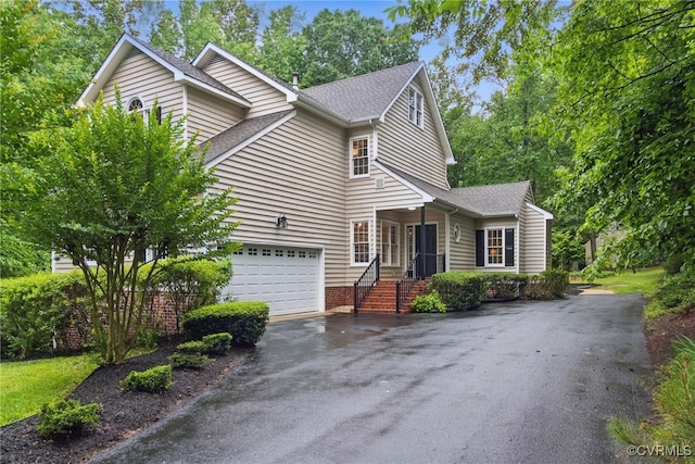 11320 Glendevon Rd, Chesterfield, VA 23838 - view of front of house with asphalt driveway, roof with shingles, and a garage