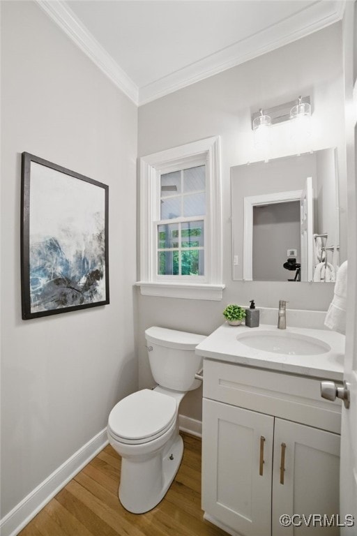 11320 Glendevon Rd, Chesterfield, VA 23838 - bathroom featuring crown molding, vanity, wood finished floors, baseboards, and toilet