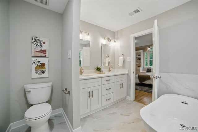 11320 Glendevon Rd, Chesterfield, VA 23838 - bathroom with a soaking tub, double vanity, ensuite bathroom, marble look tile flooring, and toilet