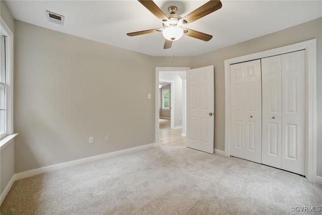 11320 Glendevon Rd, Chesterfield, VA 23838 - unfurnished bedroom with light colored carpet, baseboards, a closet, and ceiling fan