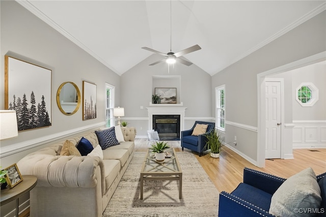 11320 Glendevon Rd, Chesterfield, VA 23838 - living room featuring wood finished floors, a glass covered fireplace, lofted ceiling, ceiling fan, and ornamental molding