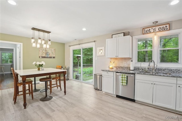 6286 Mcclellan Rd, Mechanicsville, VA 23111 - kitchen featuring dishwasher, a sink, stone counters, healthy amount of natural light, and recessed lighting