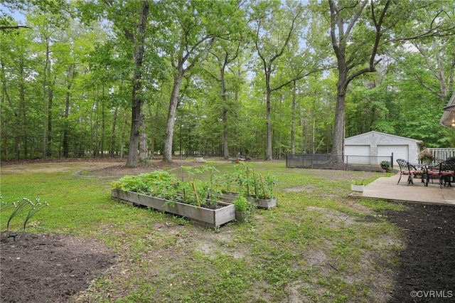 6286 Mcclellan Rd, Mechanicsville, VA 23111 - view of yard featuring a garden, a garage, and an outdoor structure