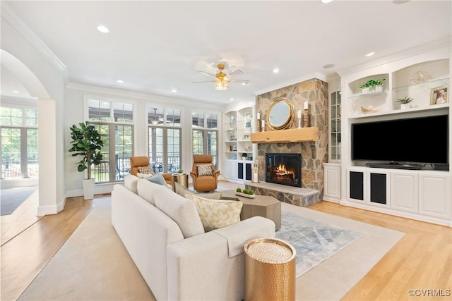 13519 Pungo Ct, Chesterfield, VA 23838 - living room with ceiling fan, crown molding, a stone fireplace, built in features, and recessed lighting