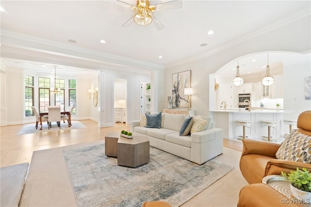 13519 Pungo Ct, Chesterfield, VA 23838 - living room featuring a ceiling fan, ornamental molding, recessed lighting, light wood-style floors, and arched walkways