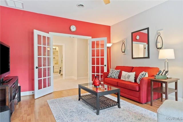 13519 Pungo Ct, Chesterfield, VA 23838 - living room featuring french doors, wood finished floors, and baseboards