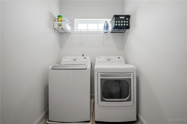 7025 Leire Dr, Chesterfield, VA 23832 - laundry area featuring separate washer and dryer and baseboards