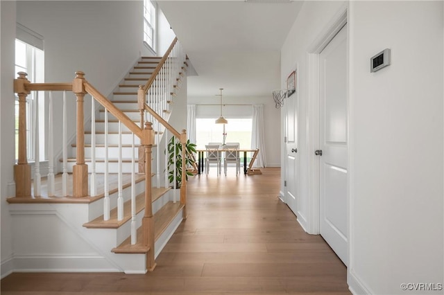 7025 Leire Dr, Chester, VA 23832 - corridor with wood finished floors, stairway, and baseboards