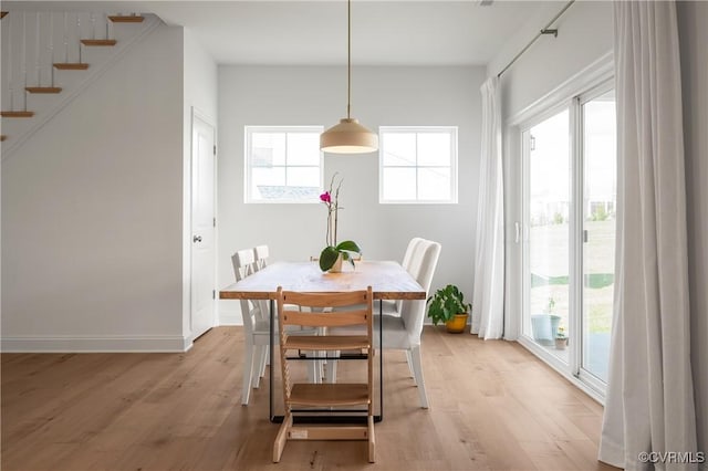 7025 Leire Dr, Chester, VA 23832 - dining area with light wood-style floors, stairs, and baseboards