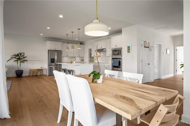 7025 Leire Dr, Chester, VA 23832 - dining space featuring light wood-type flooring, recessed lighting, and baseboards