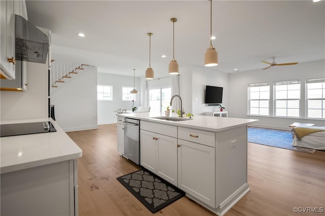 7025 Leire Dr, Chester, VA 23832 - kitchen featuring dishwasher, a sink, black electric stovetop, exhaust hood, and light wood-style flooring