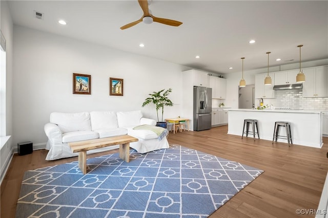7025 Leire Dr, Chester, VA 23832 - living area featuring a ceiling fan, recessed lighting, and wood finished floors