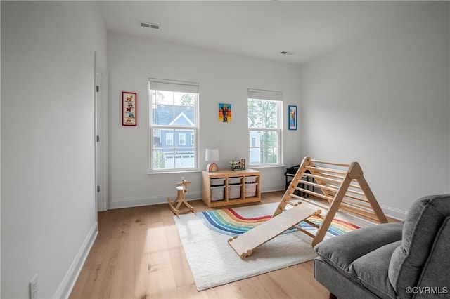7025 Leire Dr, Chester, VA 23832 - sitting room with plenty of natural light, light wood finished floors, and baseboards