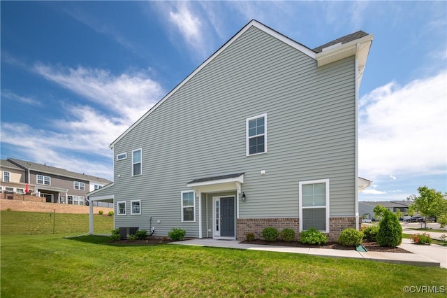 7025 Leire Dr, Chester, VA 23832 - back of house featuring a yard, brick siding, and central AC