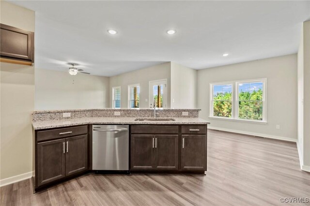 1343 Buckners Ln, Mineral, VA 23117 - kitchen with dishwasher, a sink, light wood finished floors, dark brown cabinets, and light stone counters