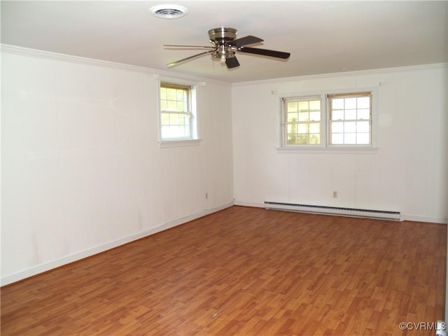 11001 Old Church Rd, New Kent, VA 23124 - spare room with baseboard heating, light wood-style flooring, crown molding, a ceiling fan, and baseboards