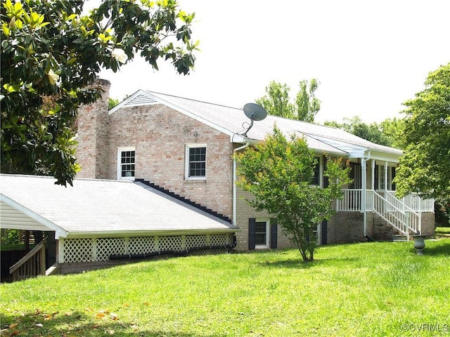 11001 Old Church Rd, New Kent, VA 23124 - rear view of property featuring a chimney, a yard, and brick siding