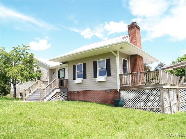 11001 Old Church Rd, New Kent, VA 23124 - view of front of home featuring crawl space, a chimney, a front lawn, and a deck