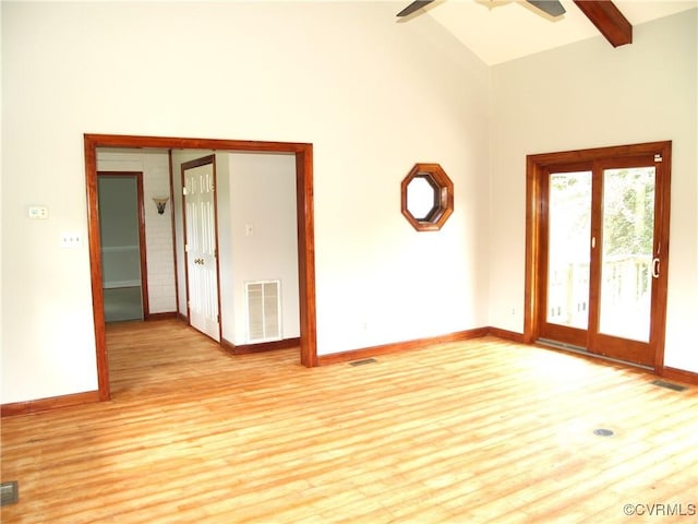 11001 Old Church Rd, New Kent, VA 23124 - unfurnished room with light wood-type flooring, ceiling fan, baseboards, beamed ceiling, and high vaulted ceiling