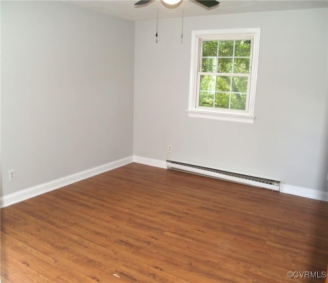 11001 Old Church Rd, New Kent, VA 23124 - spare room featuring a baseboard radiator, ceiling fan, and wood finished floors
