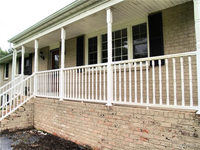 11001 Old Church Rd, New Kent, VA 23124 - view of side of home featuring brick siding and covered porch