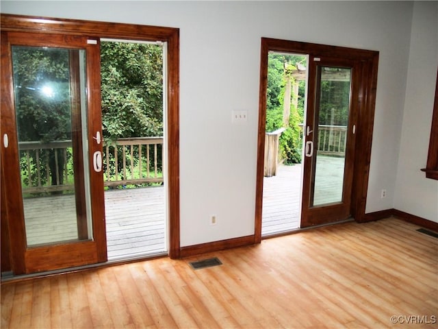 11001 Old Church Rd, New Kent, VA 23124 - doorway with healthy amount of natural light and wood finished floors