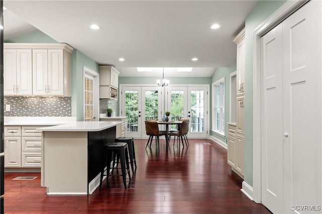 13908 Sunrise Bluff Rd, Midlothian, VA 23112 - kitchen featuring french doors, light countertops, dark wood-type flooring, backsplash, and recessed lighting