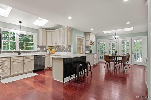 13908 Sunrise Bluff Rd, Midlothian, VA 23112 - kitchen featuring a skylight, stainless steel dishwasher, french doors, a chandelier, and recessed lighting