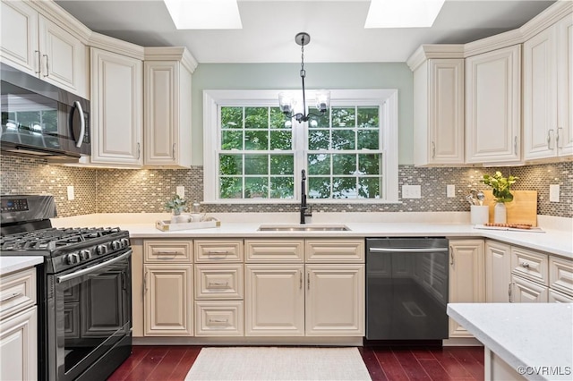 13908 Sunrise Bluff Rd, Midlothian, VA 23112 - kitchen featuring stainless steel dishwasher, gas range, a skylight, and light countertops