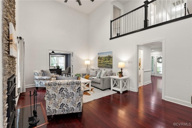13908 Sunrise Bluff Rd, Midlothian, VA 23112 - living room featuring a ceiling fan, a high ceiling, plenty of natural light, and wood-type flooring