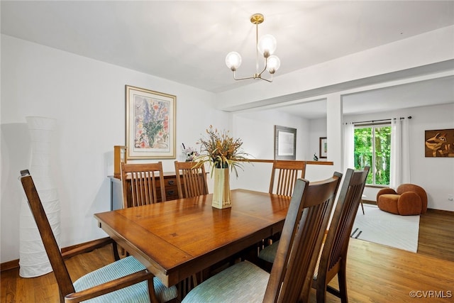 2805 Meeting Gate Ct, Chesterfield, VA 23112 - dining area with light wood-type flooring, a chandelier, and baseboards