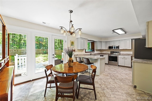 2805 Meeting Gate Ct, Chesterfield, VA 23112 - dining space with a chandelier and stone finish flooring