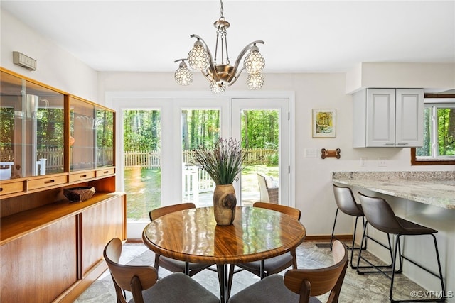 2805 Meeting Gate Ct, Chesterfield, VA 23112 - dining area with a chandelier, baseboards, and light wood finished floors