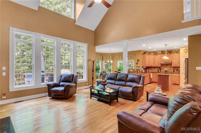 12300 Wynnstay Ln, Chesterfield, VA 23838 - living area with a high ceiling, light wood-type flooring, a ceiling fan, and baseboards