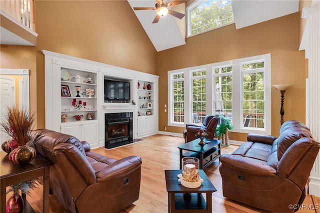 12300 Wynnstay Ln, Chesterfield, VA 23838 - living room with high vaulted ceiling, ceiling fan, light wood-style flooring, a fireplace with flush hearth, and healthy amount of natural light