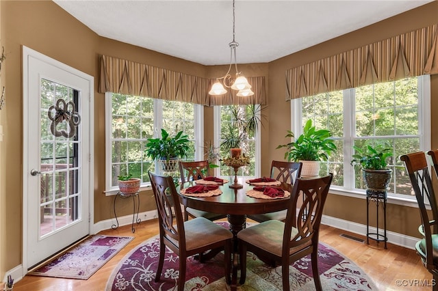 12300 Wynnstay Ln, Chesterfield, VA 23838 - dining area featuring light wood-type flooring, baseboards, and a chandelier