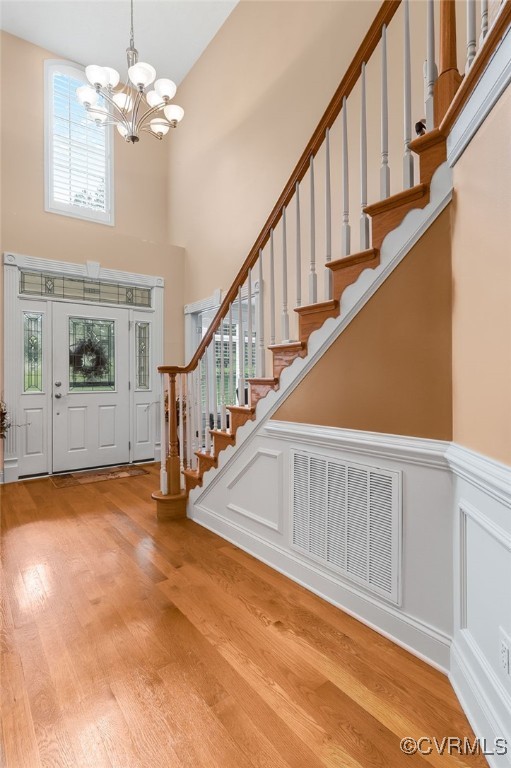 12300 Wynnstay Ln, Chesterfield, VA 23838 - foyer featuring a high ceiling, a chandelier, wood finished floors, and stairs