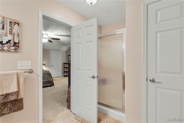 12300 Wynnstay Ln, Chesterfield, VA 23838 - full bath with a textured ceiling, connected bathroom, a stall shower, a ceiling fan, and tile patterned flooring