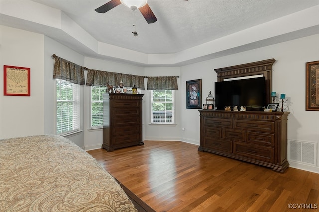 12300 Wynnstay Ln, Chesterfield, VA 23838 - bedroom with wood finished floors, baseboards, a textured ceiling, ceiling fan, and a tray ceiling