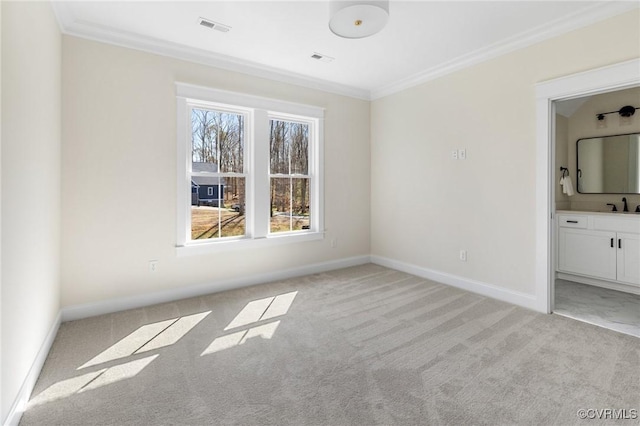 1570 Huntington Woods Trl, Powhatan, VA 23139 - unfurnished bedroom with light colored carpet, crown molding, a sink, baseboards, and ensuite bathroom
