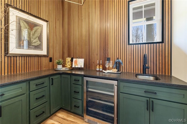 1570 Huntington Woods Trl, Powhatan, VA 23139 - indoor wet bar featuring wine cooler and light wood finished floors