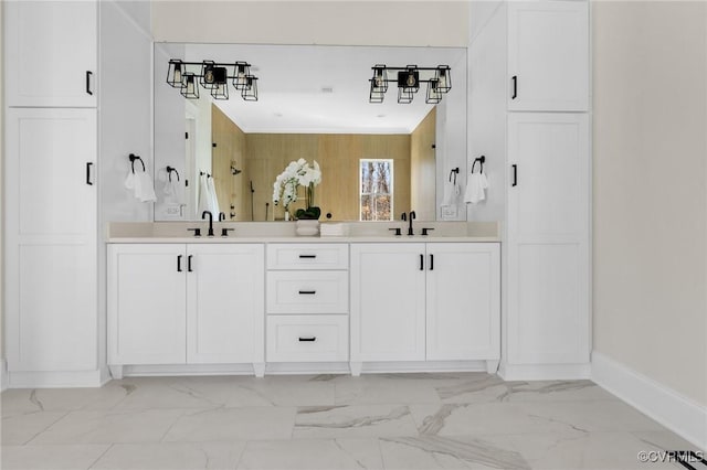 1570 Huntington Woods Trl, Powhatan, VA 23139 - bathroom featuring double vanity, baseboards, and marble finish flooring