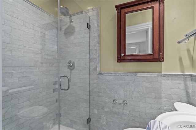 2011 Grove Ave, Richmond, VA 23220 - full bathroom featuring toilet, a shower stall, a wainscoted wall, and tile walls