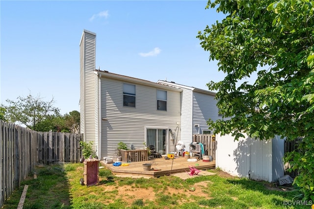4822 Ballyshannon Ct, Henrico, VA 23228 - rear view of house with a deck, a fenced backyard, and a chimney