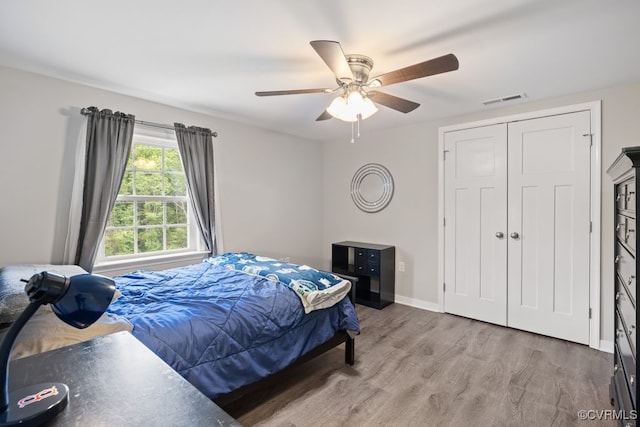 16619 Jefferson Hwy, Bumpass, VA 23024 - bedroom with wood finished floors, baseboards, ceiling fan, and a closet