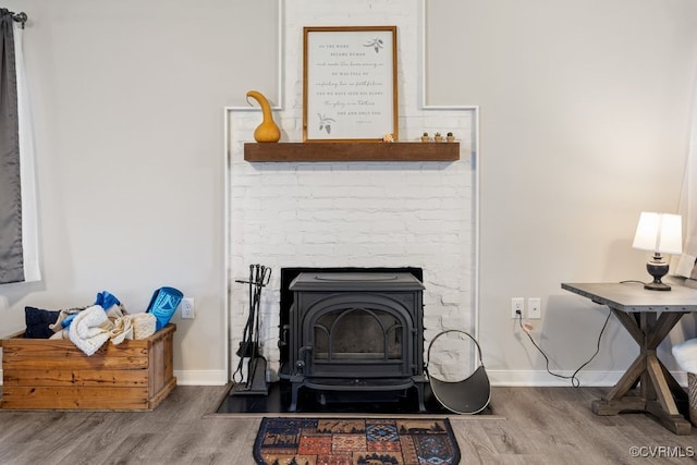 16619 Jefferson Hwy, Bumpass, VA 23024 - detailed view of wood finished floors, baseboards, and a wood stove