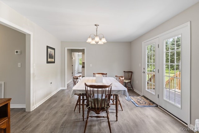 16619 Jefferson Hwy, Bumpass, VA 23024 - dining room with wood finished floors, baseboards, and a chandelier