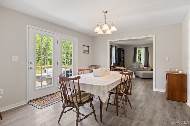 16619 Jefferson Hwy, Bumpass, VA 23024 - dining room with wood finished floors, a chandelier, and baseboards